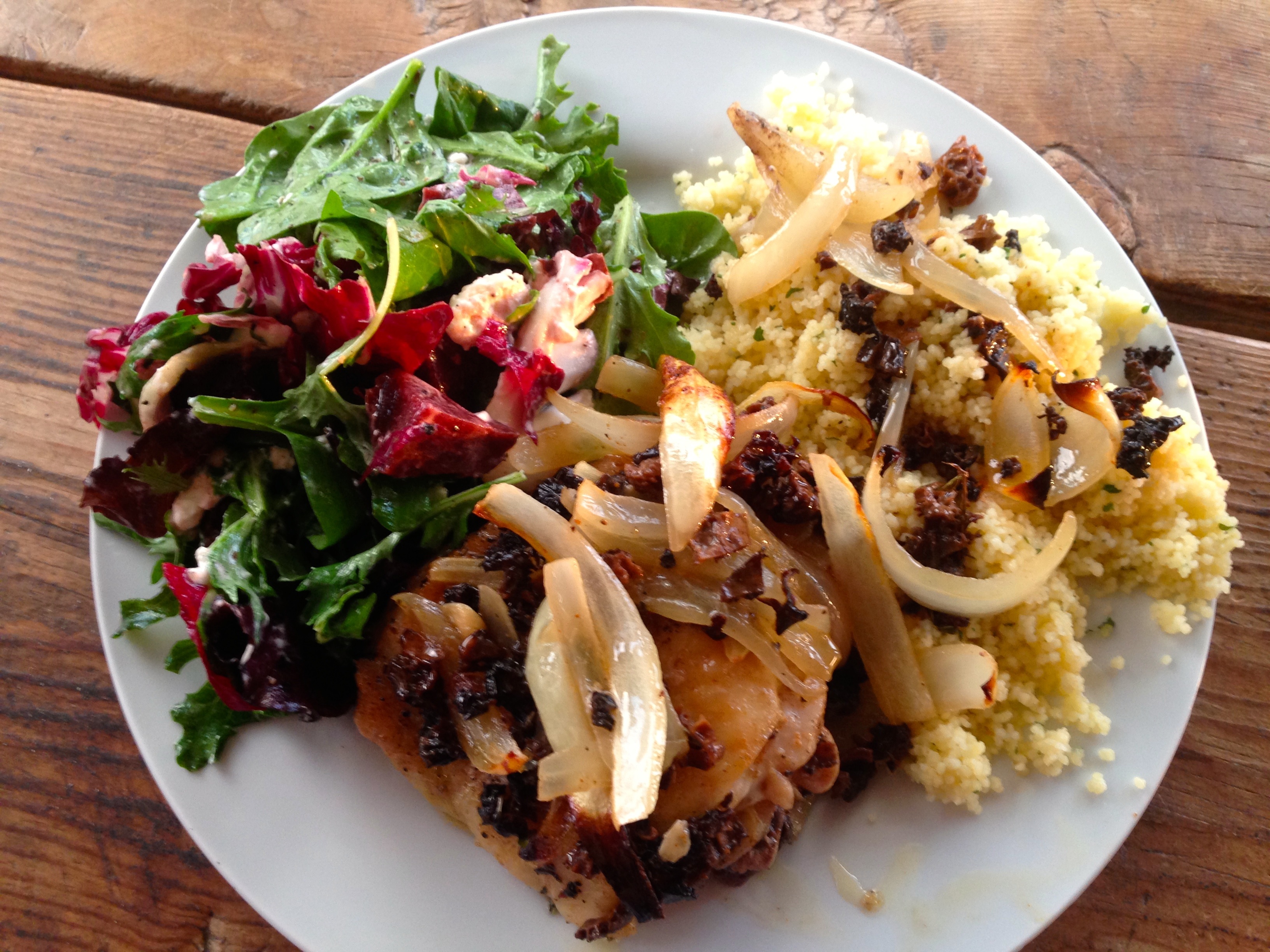 Roasted chicken thighs with couscous and salad